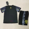 Brazil Christ the Redeemer kids' shirt in black with center pattern, yellow logos, and Brazilian flag near the crest.