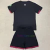 West Ham United Away Kit Kids 2024/25 featuring a black base with Claret trim, graphic of St Mary-le-Bow, and Bow Bells motif on the neck.