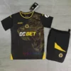 Wolves Away Kit Kids 2024/25 with central logo, wolf motif, and gold accents.