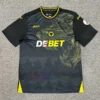 Front view: Wolves Away Shirt 202425 with central logo, wolf motif, and gold accents.